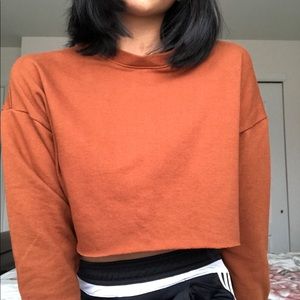 cropped orange sweatshirt